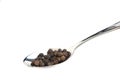 Spoon with black pepper