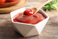 Spoon and bowl with homemade tomato sauce Royalty Free Stock Photo