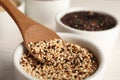 Spoon and bowl with mixed quinoa seeds Royalty Free Stock Photo