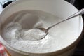 Spoon in bowl of Vitamin C Powder