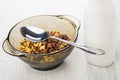 Spoon in brown bowl with breakfast cereals, bottle of yogurt Royalty Free Stock Photo