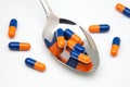 Spoon with capsulas medicas Royalty Free Stock Photo
