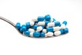 Spoon and capsulas medicas Royalty Free Stock Photo