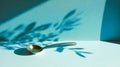 The spoon casts soft, subtle shadows on a flat, monochrome background Royalty Free Stock Photo