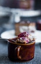 Spoon with chocolate cake with butter cream and cherries, cup Royalty Free Stock Photo