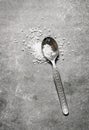 Spoon coarse salt. On stone background. Royalty Free Stock Photo