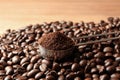 Spoon with coffee grounds and roasted beans on table Royalty Free Stock Photo