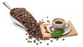 .Spoon Coffee scoop and coffee beans roasted with hot coffee cup On a chopping block wood Royalty Free Stock Photo