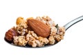 Spoon with crunchy muesli and nuts. Royalty Free Stock Photo