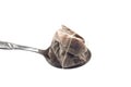 Spoon with crushed and used tea bag Royalty Free Stock Photo