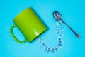 Spoon and cup with microplastics Royalty Free Stock Photo
