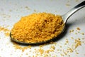 A spoon of delicious yellow cookie powder