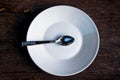 Spoon and empty dish Royalty Free Stock Photo