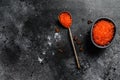 Spoon of Exquisite red caviar. Black background. Top view. Copy space