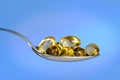 Spoon With Fish Oil Pills Royalty Free Stock Photo