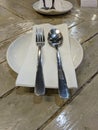 Spoon and fork on an empty white plate Royalty Free Stock Photo