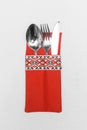 Spoon fork and knife cutlery utensil silverware in traditional ornament style on white tablecloth background
