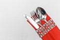 Spoon fork and knife cutlery utensil silverware in traditional ornament style on white tablecloth background