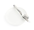 Spoon, fork and knife over the white plate Royalty Free Stock Photo