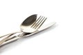 a spoon, fork and knife stacked up on a white background Royalty Free Stock Photo