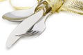 Spoon, fork and a knife tied up celebratory ribbon