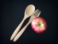 Spoon, fork and red apple diet and nutrition. Royalty Free Stock Photo