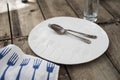 Spoon and Fork on White Dinner Plate with Engraved Fork Pattern Royalty Free Stock Photo