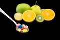 Spoon full of colorful pills Royalty Free Stock Photo