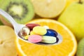 Spoon full of colorful pills Royalty Free Stock Photo