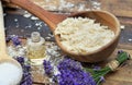 Spoon full of flakes of soap with essential oil and  lavender flowers Royalty Free Stock Photo