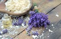 Spoon full of flakes of soap with essential oil and lavender Royalty Free Stock Photo