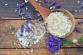 Spoon full of flakes of soap with essential oil and  lavender flowers Royalty Free Stock Photo