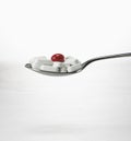 Spoon full of tablets Royalty Free Stock Photo