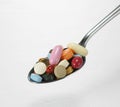 Spoon full of tablets Royalty Free Stock Photo