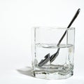 Spoon in a glass with clear water