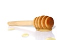 Spoon with honey lies on a white background Royalty Free Stock Photo