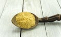 Spoon with Kava Kava root powder on wooden table closeup Royalty Free Stock Photo