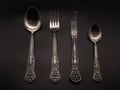 Spoon, knife, fork on a dark background Royalty Free Stock Photo