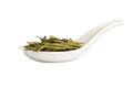 Spoon with long leaves green loose tea, isolated