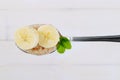 Spoon of oatmeal porridge with banana