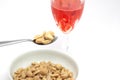 Spoon of peanuts and glass of drink isolated on a white background Royalty Free Stock Photo