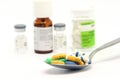 Spoon pills and bottles Royalty Free Stock Photo