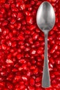 Spoon on pomegranate seeds