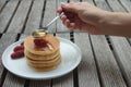 Spoon pouring honey on pancakes Royalty Free Stock Photo