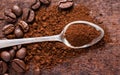 spoon with powder and coffee beans on old wooden spoon Royalty Free Stock Photo