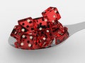 Spoon with red dices Royalty Free Stock Photo