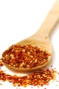 Spoon of red pepper flakes Royalty Free Stock Photo