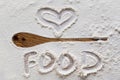 Spoon silhouette and text in flour