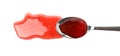 Spoon with strawberry jam isolated on background Royalty Free Stock Photo