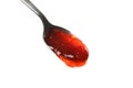 Spoon with strawberry jam isolated on background Royalty Free Stock Photo